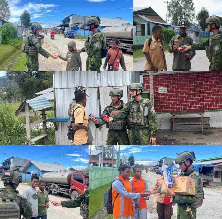 Mengukir Senyum di Tanah Papua, Satgas Marinir Gobang 8 Berbagi Cokelat untuk Anak-Anak Waghete