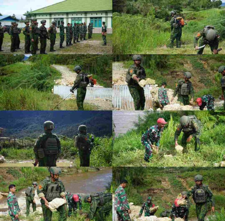 Prajurit Satgas Yonif 2 Marinir dan Kodim 1703/Deiyai Bersinergi Bangun Jembatan Garuda